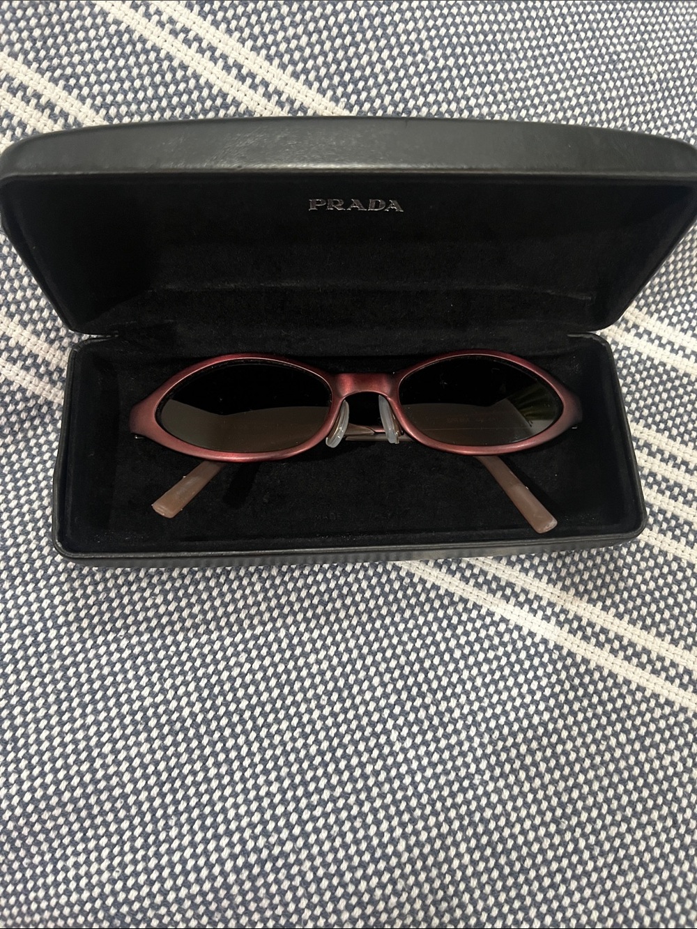 Prada Women's Oval Sunglasses in Deep Burgundy with Dark Lenses